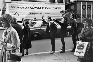 © Daniel Kramer. Above Bob Dylan With Peter Yarrow & John Hammond Jr. Hailing Taxi 1965, NYC.
